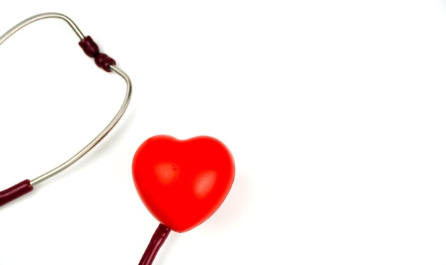 Red heart with stethoscope on white background Selective focus health and Medical concept