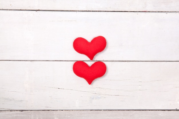 Red heart on wood table from top view with space for copy. Valentines day concept.