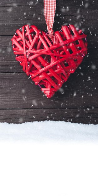 Red heart over a wooden background Valentine's day greeting card