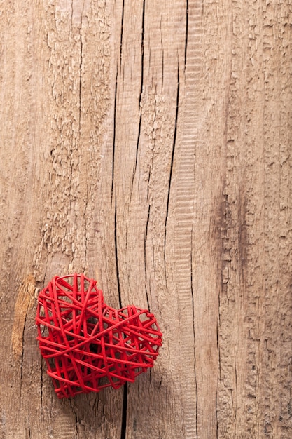 Red heart over wooden background for Valentines