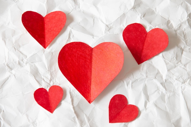 Red hearts paper on White crumpled paper, valentine's day beautiful background