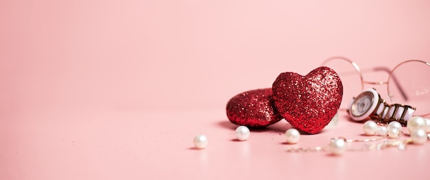 Red hearts shiny, valentine's day fashion concept, on pink background, copy space, banner. High quality photo