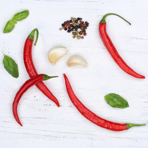 Red hot chili peppers chilli cooking ingredients square background top view