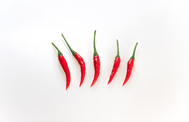 Red hot chili peppers on white background