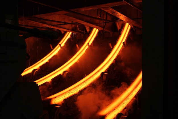 Red hot steel metal billets after molten steel casting.