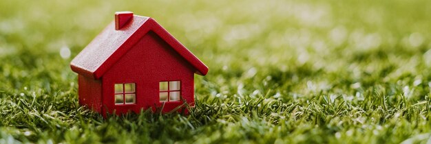 a red house sits on the grass