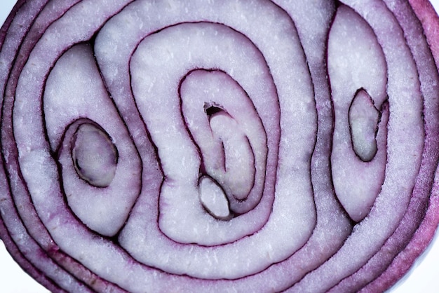 Red italian onion in a cut on a white plate Food background