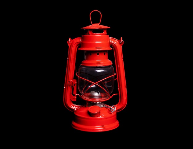 Red kerosene lamp on a black background isolated object closeup cut out