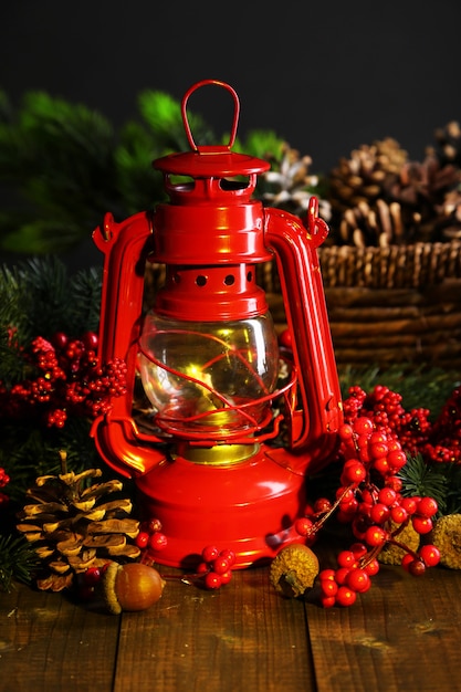 Red kerosene lamp on dark background