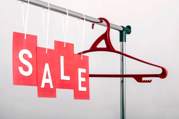 Red labels with the inscription sale on a light background