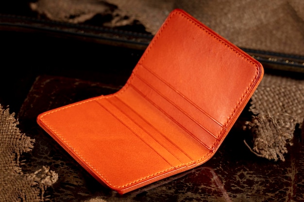 Red leather wallet on a dark background