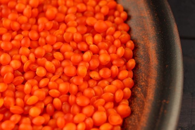 Red lentil in a plate close-up