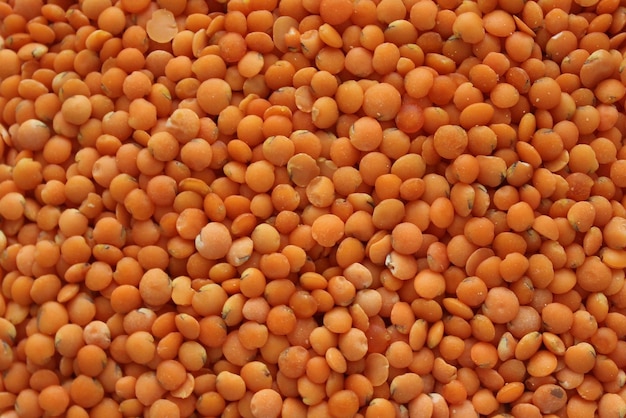 Red lentils in bulk top view.