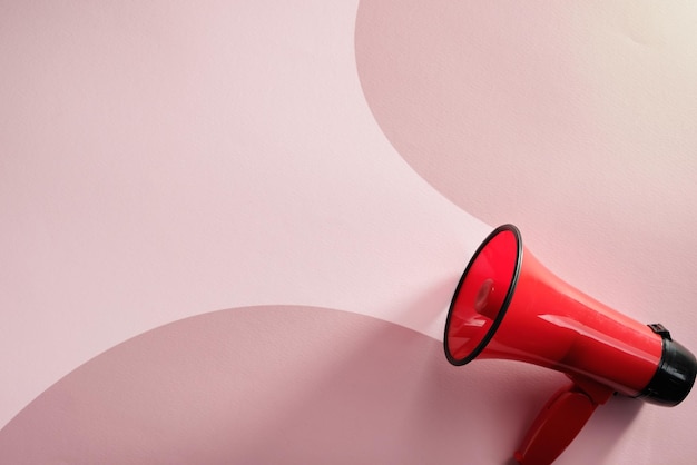 red megaphone on the pink background