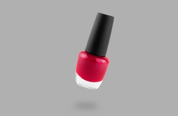 Red nail polish bottle isolated