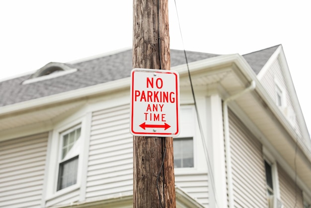 red 'No Parking' sign signifies restricted areas embodying order compliance and traffic control i