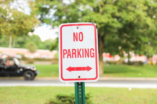 red 'No Parking' sign signifies restricted areas embodying order compliance and traffic control i