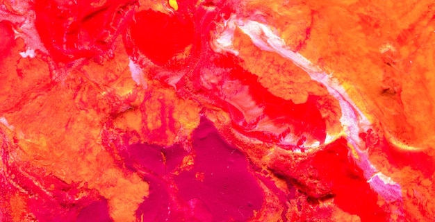 Red and orange paint in a bowl