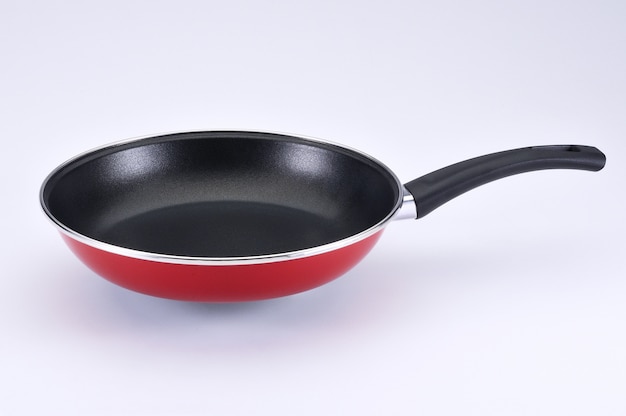 Red pan with black handle