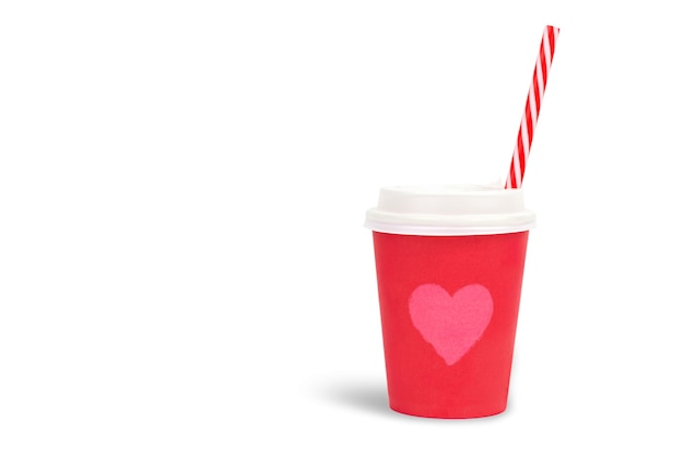 Red paper cup with a picture of a heart and a red straw on a white wall