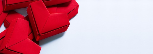 Red paper hearts and spaces saying text,Paper hearts on a white background,Red paper heart isolated