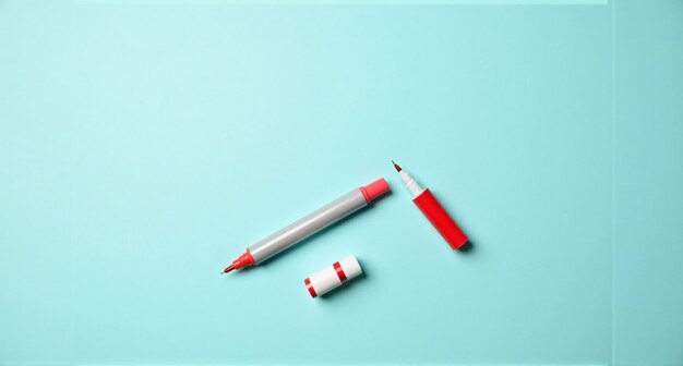 a red pen and a pen with the word cross on it