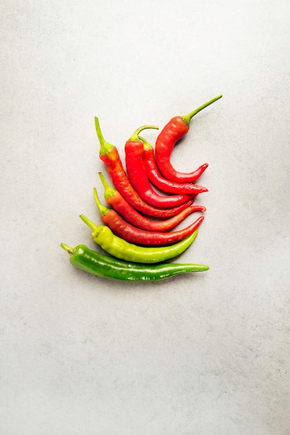 Red pepper pods on a gray tile plate