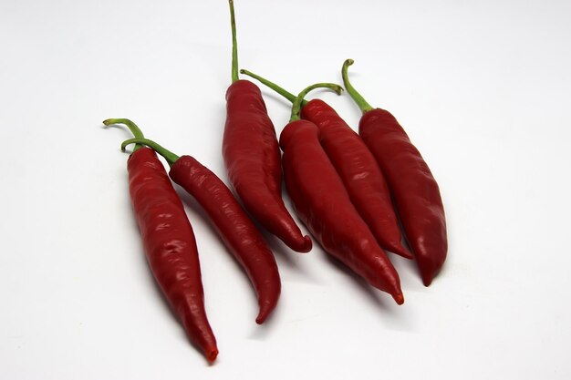 a red pepper with seeds on it is on a white background