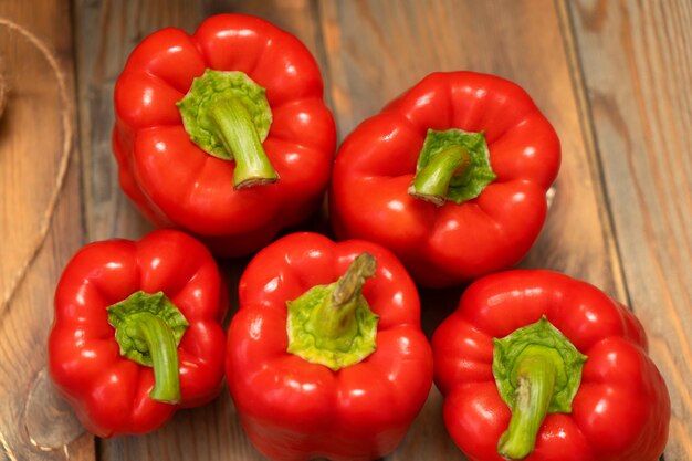 Red peppers on a wooden background