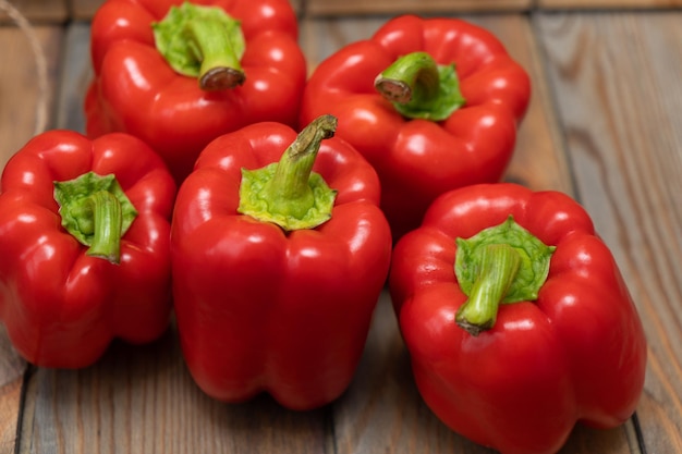 Red peppers on a wooden background