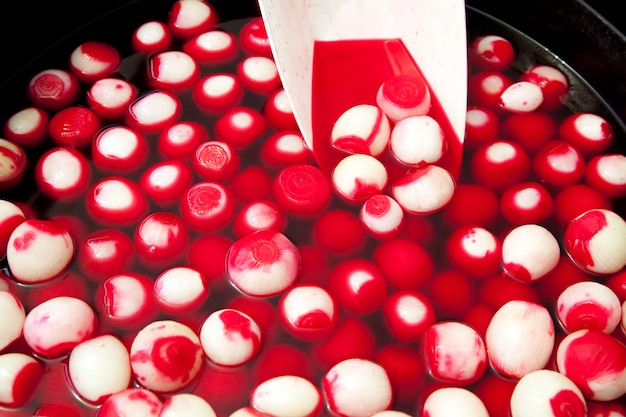 red pickled onions in market