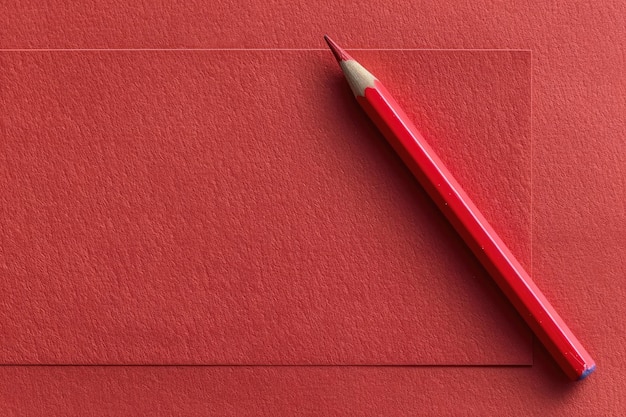 Photo a red piece of paper with a red pencil on it