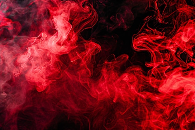 Red and pink smoke on a black isolated background Background from the smoke of vape