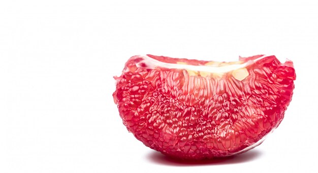 Red pomelo pulp with seeds isolated on white background with clipping path