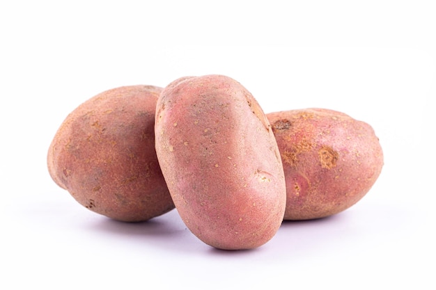 Red potatoes on white background