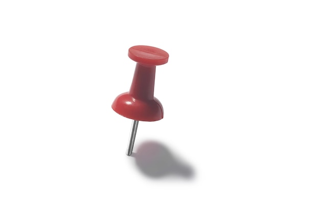 Red push pin on a white background