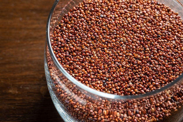 red quinoa on dark texture