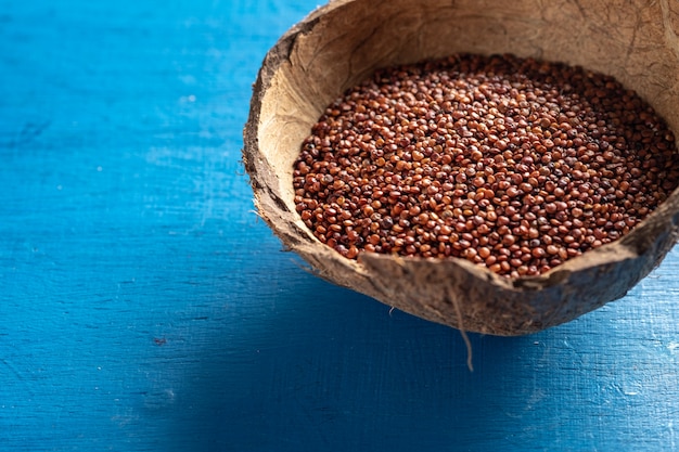 red quinoa on dark texture