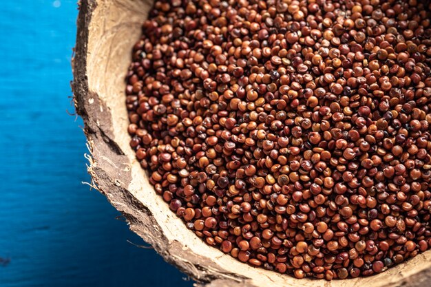 red quinoa on dark texture