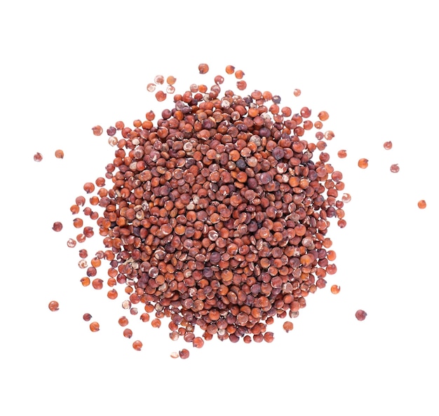 Red quinoa seeds isolated on white background Pile of raw kinwa Top view