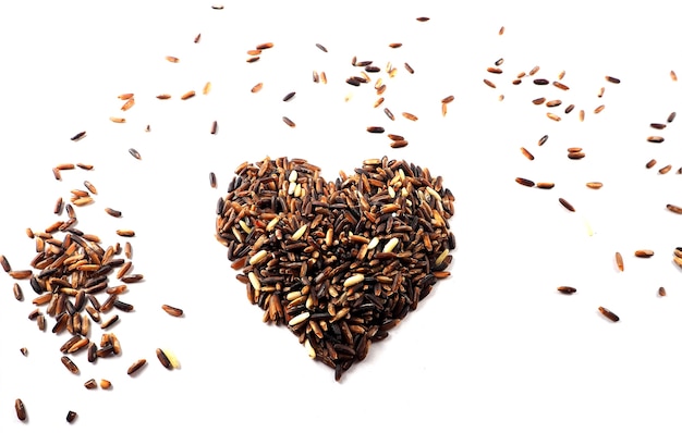 Red raw rice,brown rice and mixed grains into a heart shape,healthy concept,Valentine conc