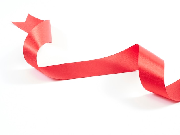 Red ribbon curved isolated on white