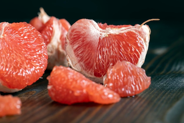 Red ripe grapefruit on a cutting board