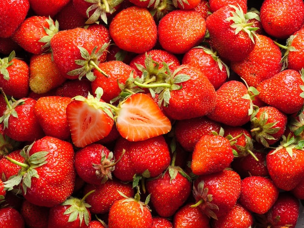 Red ripe strawberries background Close up top view