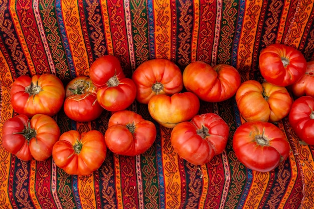 Red ripe tasty fresh delicious tomato vegetables in bazaar market