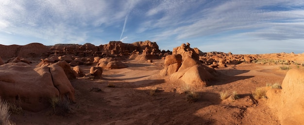 Red rock formations in desert at sunny sunrise spring season