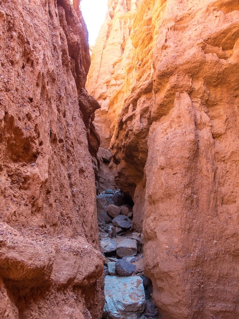 Red rocks and a passage between rocks Clay canyons IssykKul region in Kyrgyzstan Travel and tourism