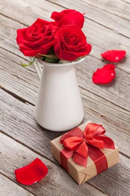 Red rose flowers in pitcher