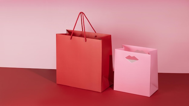 Red and rose paper shopping bags mockup