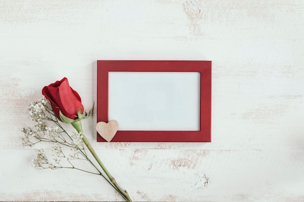 Red rose and white flower with heart and frame